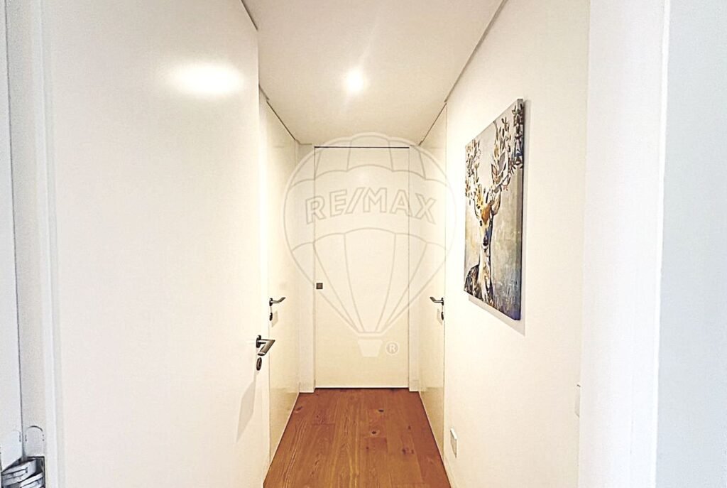 Clean and well-lit interior corridor connecting the various living spaces.