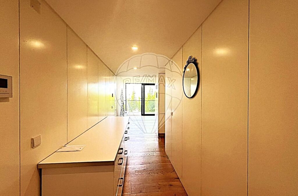 Bright, modern ground-floor corridor of the Sector 5 building featuring minimalist architecture.