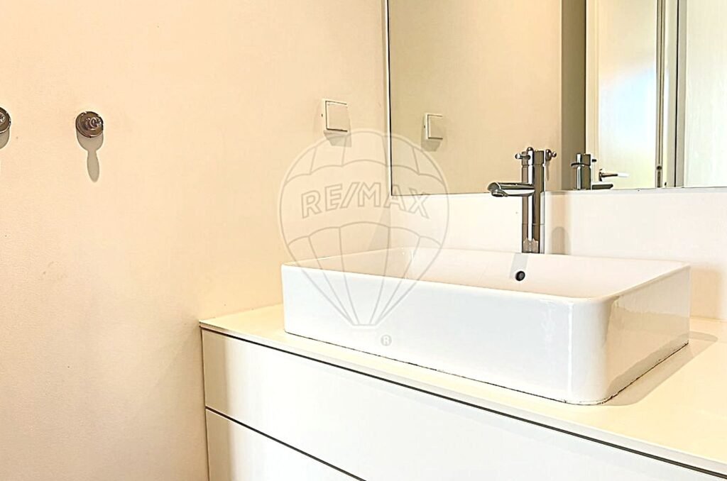 Close-up of a modern bathroom vanity featuring a sleek basin and designer fixtures.