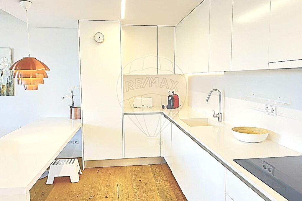 Side view of the kitchen highlighting the premium kitchen island and breakfast bar.