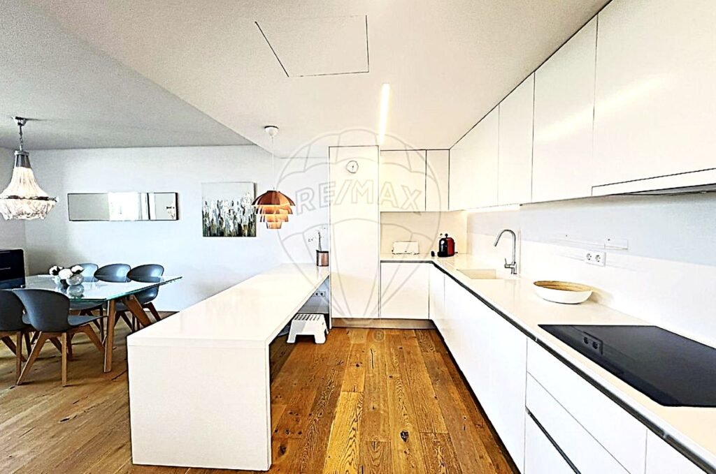 Functional kitchen layout featuring a contemporary dining table for casual meals.