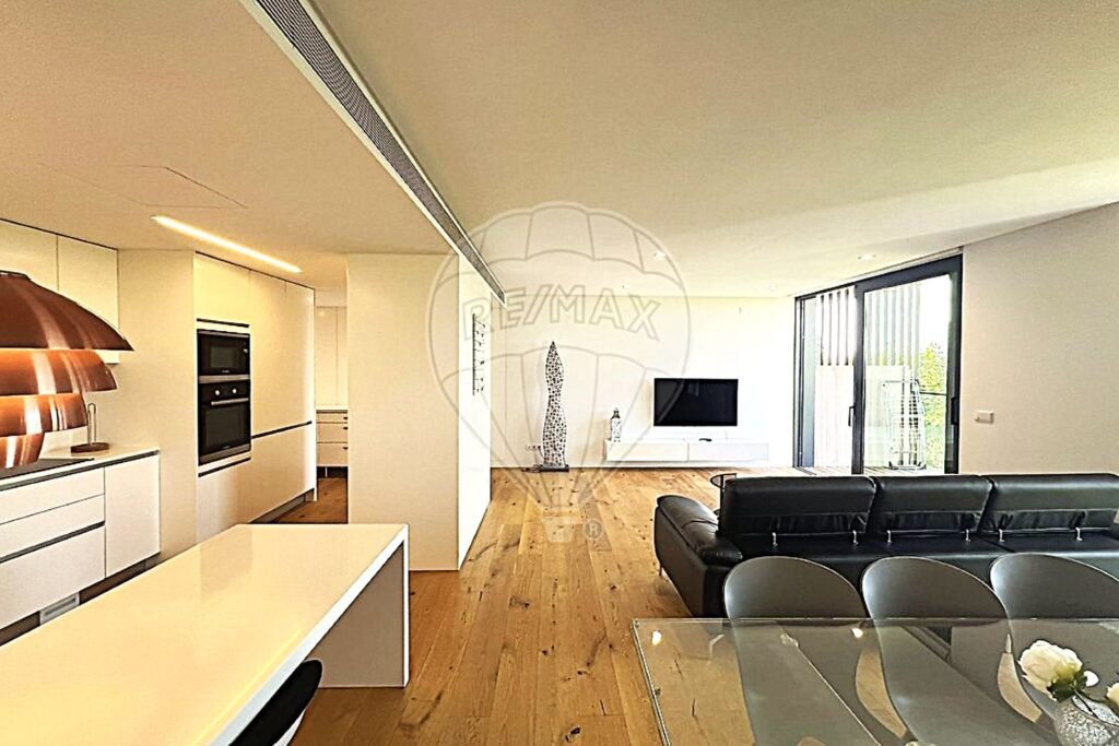 Open-concept living space showing the seamless transition between the dining area and the lounge.