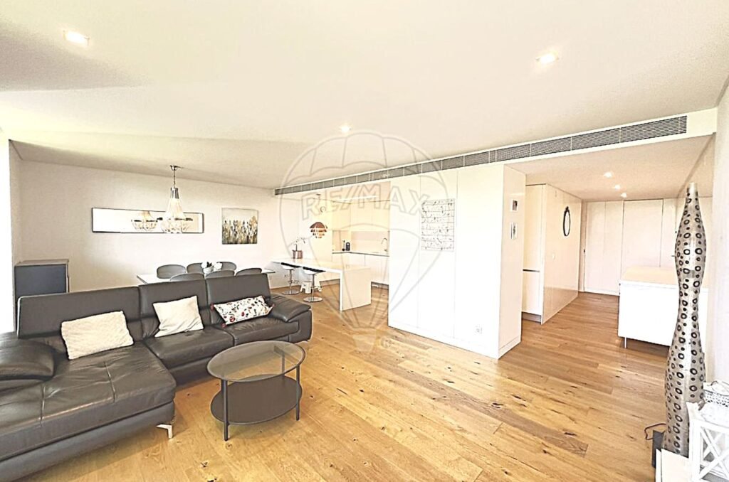 Interior view of a spacious, modern lounge with contemporary furniture and neutral tones.