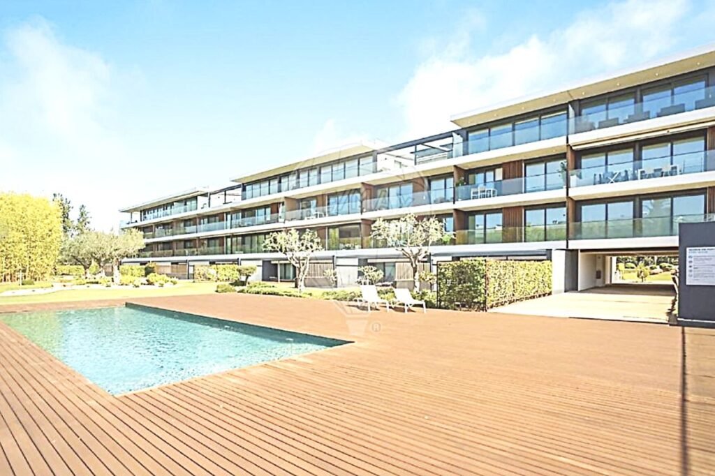 Scenic view of the Sector 5 residential building reflected in the clear water of the outdoor swimming pool.