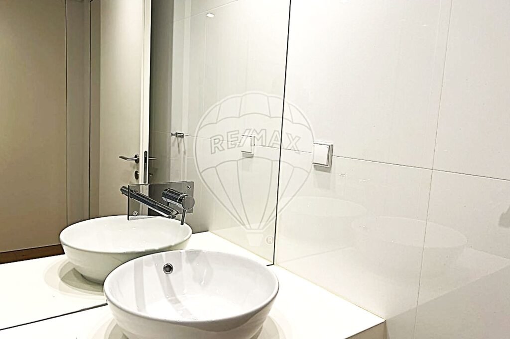 Detail shot of the second bathroom’s modern basin and minimalist vanity.