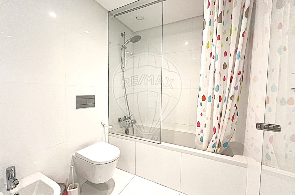 Full view of a clean, spa-like bathroom featuring a large soaking bathtub.