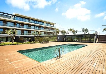 Pool and apartments in Nature Apartments, Sector 5