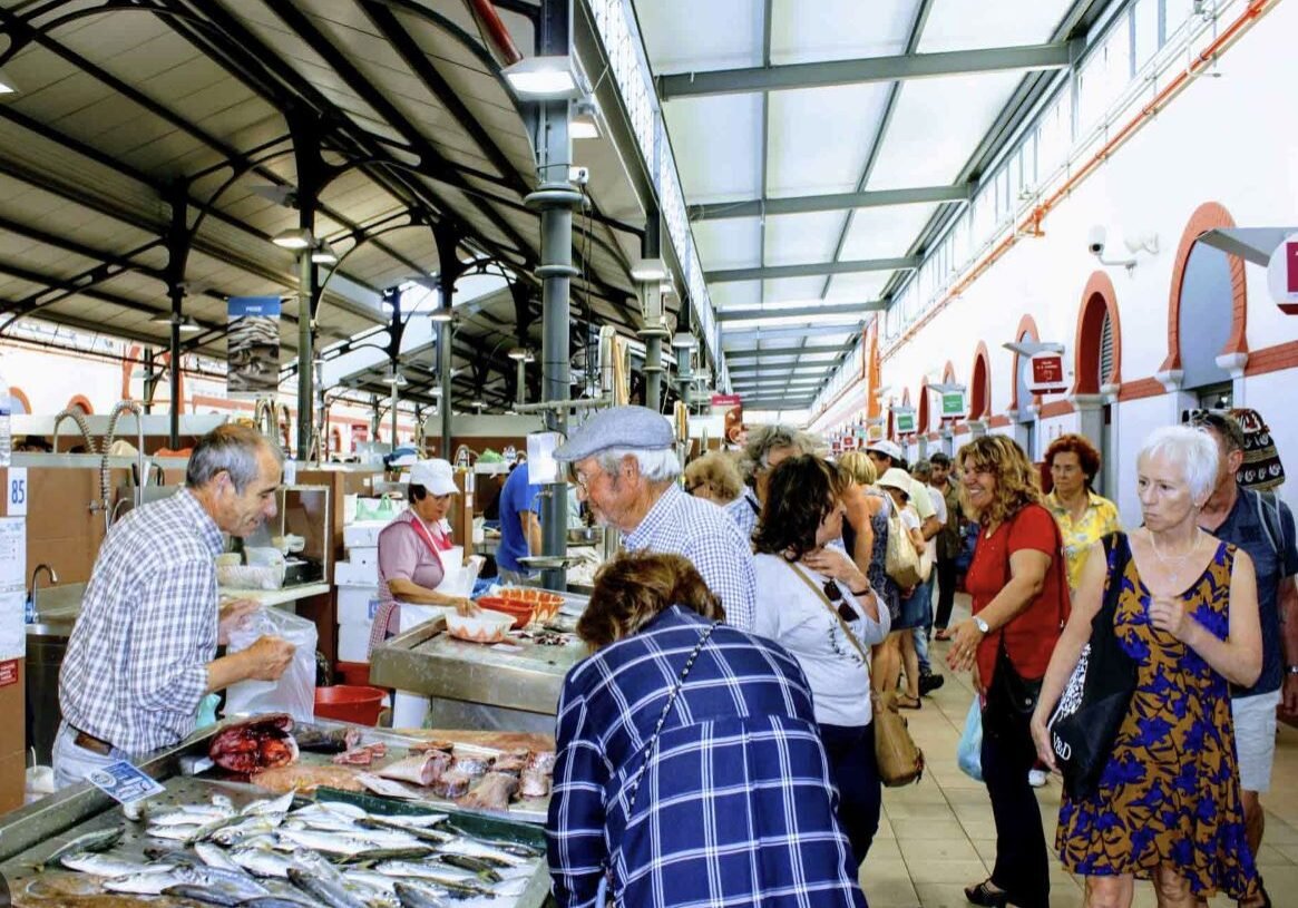 Quarteira real estate Portugal local fish market and town atmosphere
